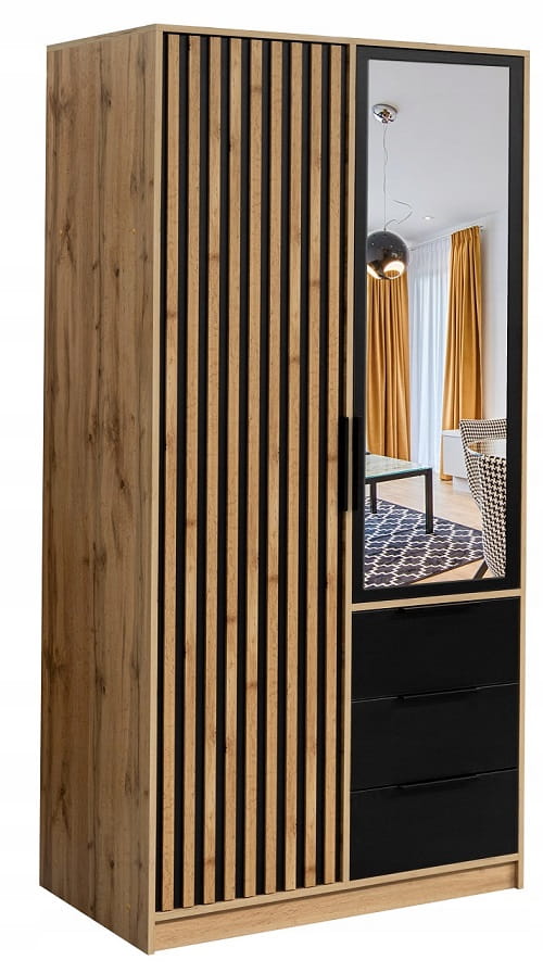 Schmaler Kleiderschrank mit Lamellentür, Spiegel und drei schwarzen Schubladen.