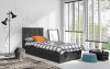 Modernes Jugendbett in Dunkelgrau mit Bettkasten in einem Kinderzimmer.