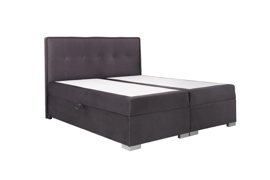 Anthrazitfarbenes Boxspringbett mit gepolstertem Kopfteil auf weißem Hintergrund.