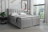 Hellgraues Boxspringbett mit edler Knopfheftung am Kopfteil für ein gemütliches Schlafzimmer.
