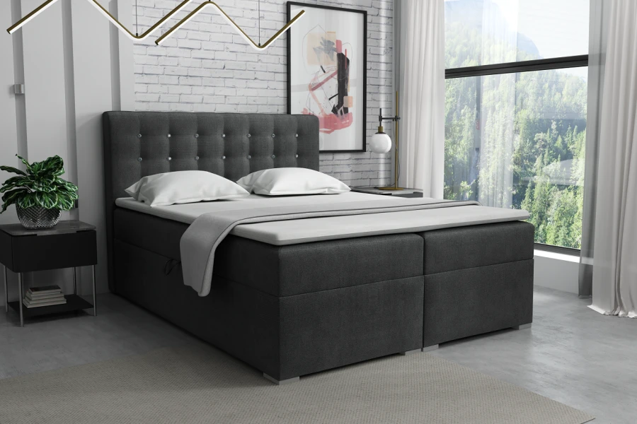 Anthrazitfarbenes Boxspringbett mit gepolstertem Kopfteil und Kristalldetails im Schlafzimmer.