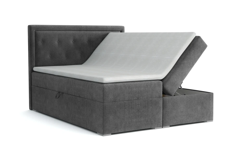 Graues Boxspringbett mit offenem Bettkasten für Stauraum und gepolstertem Kopfteil.