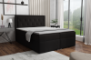 Schwarzes Boxspringbett im modern eingerichteten Schlafzimmer mit Fensterfront.