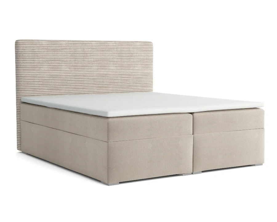 Beiges Boxspringbett mit geripptem Kopfteil in Cord-Optik, freigestellt auf weißem Hintergrund.