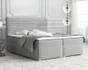 Graues Boxspringbett mit hohem gestreiftem Kopfteil in modernem Schlafzimmer-Design.