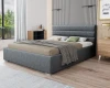 Modernes graues Polsterbett mit gestepptem Kopfteil in einem hellen Schlafzimmer.