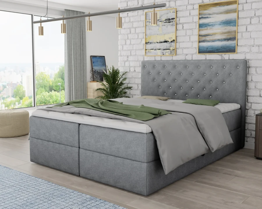 Hellgraues Boxspringbett mit luxuriöser Steppung und stilvollem Design