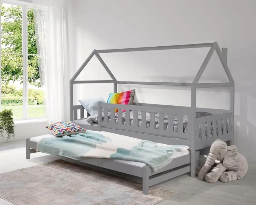 Graues Kinderhausbett mit ausziehbarem Unterschiebebett für Übernachtungsgäste.