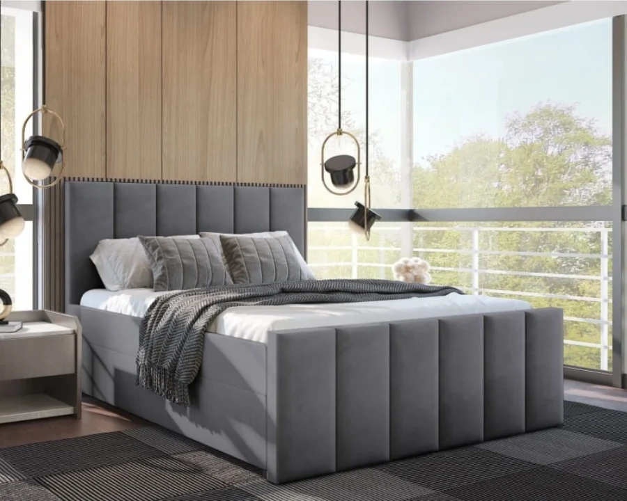 Graues Polsterbett in modernem Design mit gepolstertem Kopfteil und Bettrahmen.