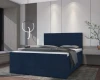 Modernes Boxspringbett in Dunkelblau mit großem gestepptem Kopfteil in stilvollem Schlafzimmerambiente.