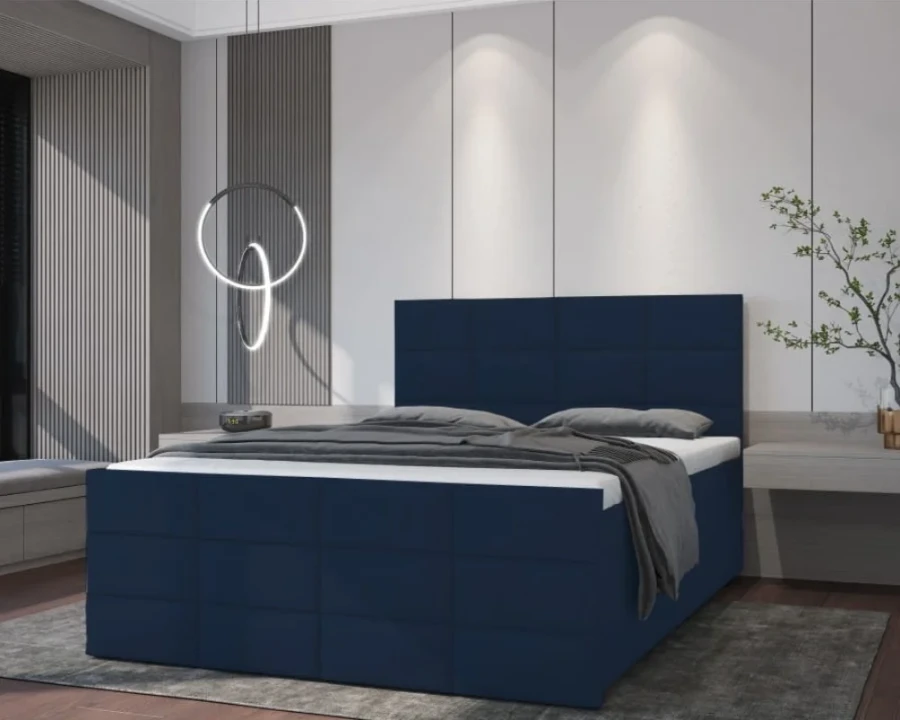 Modernes Boxspringbett in Dunkelblau mit großem gestepptem Kopfteil in stilvollem Schlafzimmerambiente.