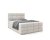 Elegantes beiges Boxspringbett mit moderner quadratischer Steppung an Kopfteil und Rahmen.