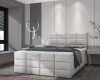 Helles Boxspringbett in Creme im modernen Schlafzimmer-Design mit grauer Bettwäsche und Teppich.