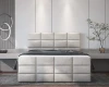 Frontansicht Boxspringbett in Beige mit markantem Steppmuster in einem eleganten Schlafzimmer.