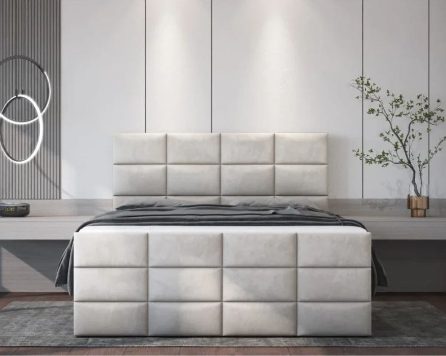 Frontansicht Boxspringbett in Beige mit markantem Steppmuster in einem eleganten Schlafzimmer.