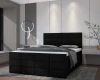 Modernes Boxspringbett in Schwarz mit gepolstertem Kopfteil für ein stilvolles Schlafzimmer.