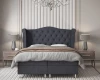 Luxuriöses Schlafzimmer mit grauem Boxspringbett, passenden Nachttischen und eleganten Lampen.