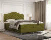 Grünes Boxspringbett mit Chesterfield-Kopfende im Schlafzimmer.