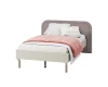 Modernes Einzelbett mit mauvefarbenem Kopfteil und rosa Bettwäsche.