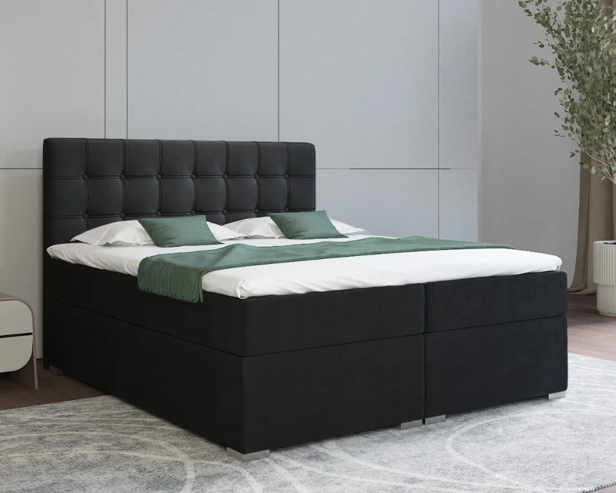 Elegantes schwarzes Boxspringbett mit gepolstertem Rückenteil.