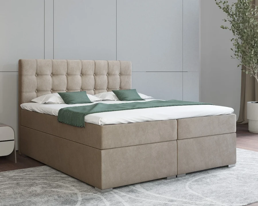 Stilvolles beiges Boxspringbett mit moderner quadratischer Steppung.