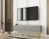 Graues TV-Board mit geriffelter Front und eleganten goldenen Beinen für das Wohnzimmer.