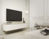 Modernes weißes TV-Board hängend mit Gold-Akzenten im stilvollen Wohnzimmer.