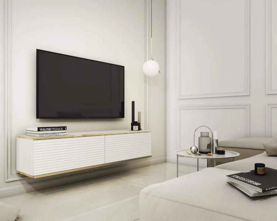 Modernes weißes TV-Board hängend mit Gold-Akzenten im stilvollen Wohnzimmer.