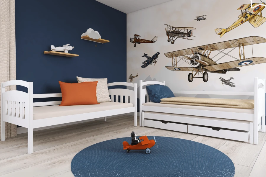 Two separate white children's beds in a room with an aeroplane wall mural.