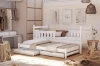 Weißes Kinderbett mit Ausziehbett und Schubladen in einem gemütlichen Kinderzimmer.
