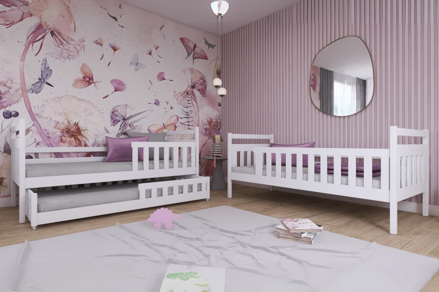 Set of two white children's beds, including pull-out bed, in a modernly designed girl's room.