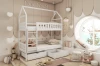 White house-shaped bunk bed with drawers in a cosy children's room