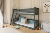 Modernly furnished children's room with grey bunk bed, teddy bear and giraffe wall mural.