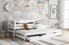 Weißes Funktionsbett im Kinderzimmer mit zweiter Liegefläche und Bettkasten – ideal für Geschwister.