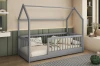 Graues Hausbett für Kinder mit schützender Umrandung in einem stilvollen, modernen Kinderzimmer.