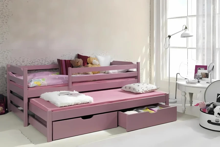 Rosa Kinderbett mit Ausziehbett und zwei Schubladen aus Massivholz für das Kinderzimmer.