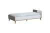 Modernes Jugendbett in Weiß und Grau mit schlichtem Design und Holzbeinen.