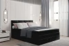 Elegantes schwarzes Polsterbett mit hohem Kopfteil in einem modern gestalteten Schlafzimmer.