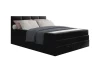 Stilvolles schwarzes Boxspringbett mit Bettkasten für zusätzlichen Stauraum im Schlafzimmer.