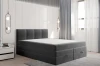 Modernes dunkelgraues Boxspringbett in Anthrazit mit abgestepptem Kopfteil.