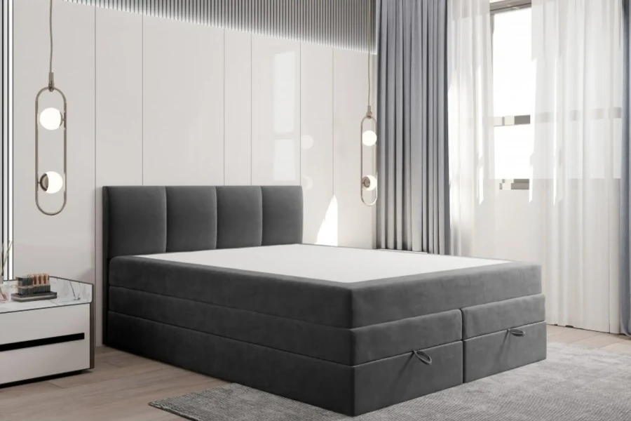 Modernes dunkelgraues Boxspringbett in Anthrazit mit abgestepptem Kopfteil.