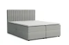 Elegantes hellgraues Boxspringbett mit vertikal gestepptem Kopfteil.