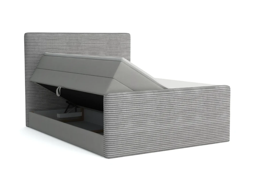 Hellgraues Boxspringbett mit geöffnetem Bettkasten für Stauraum