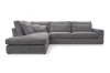 Graues Ecksofa aus Cordstoff, bequeme Couch mit Ottomanen links.