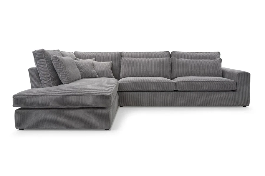 Graues Ecksofa aus Cordstoff, bequeme Couch mit Ottomanen links.