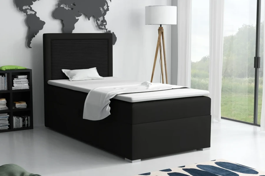Schwarzes Boxspringbett 90x200 cm im modern eingerichteten Schlafzimmer.