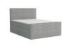 Modernes hellgraues Boxspringbett mit Cord-Bezug auf weißem Hintergrund.