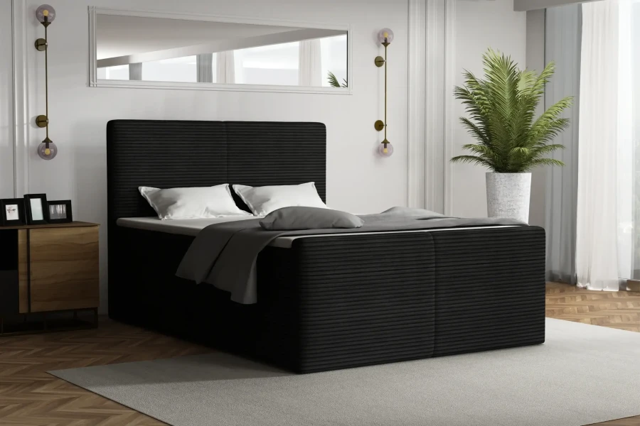 Elegantes schwarzes Boxspringbett mit Cord-Muster im hellen Schlafzimmer.