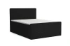 Modernes schwarzes Boxspringbett in eleganter Cord-Optik vor weißem Hintergrund.