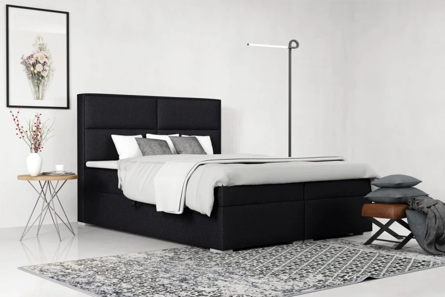 Elegantes schwarzes Boxspringbett in einem modern gestalteten Schlafzimmer.